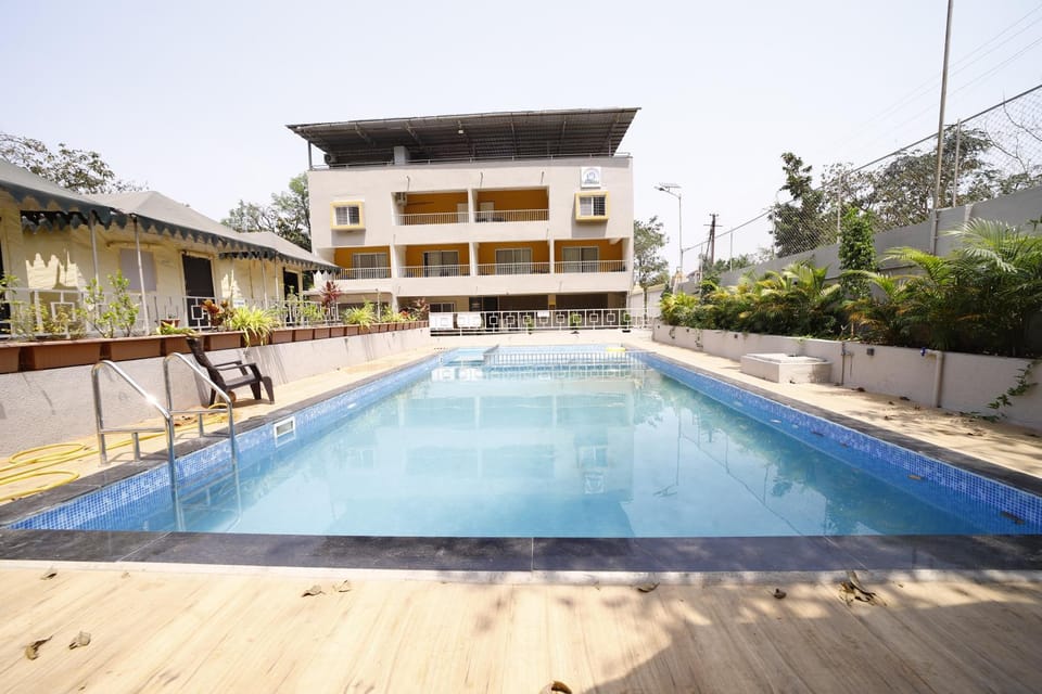 Property building, Facade/entrance, Day, Pool view, Swimming pool