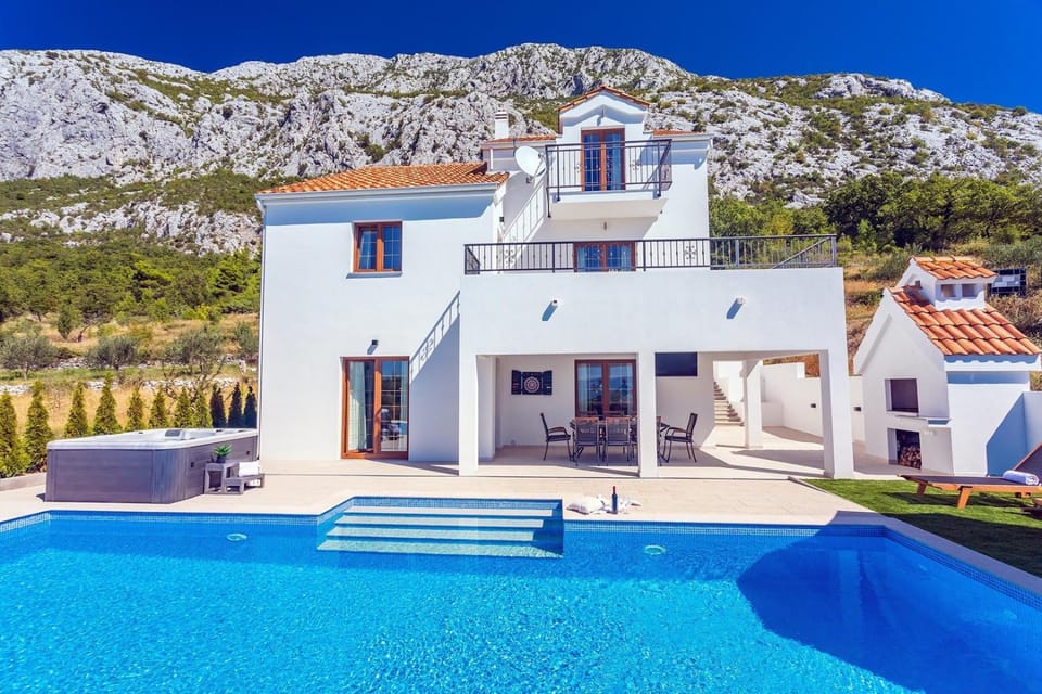 Villa Flora with a 53 sqm private pool with Cinema room with projector and 4 en-suite bedrooms Villa in Split-Dalmatia County