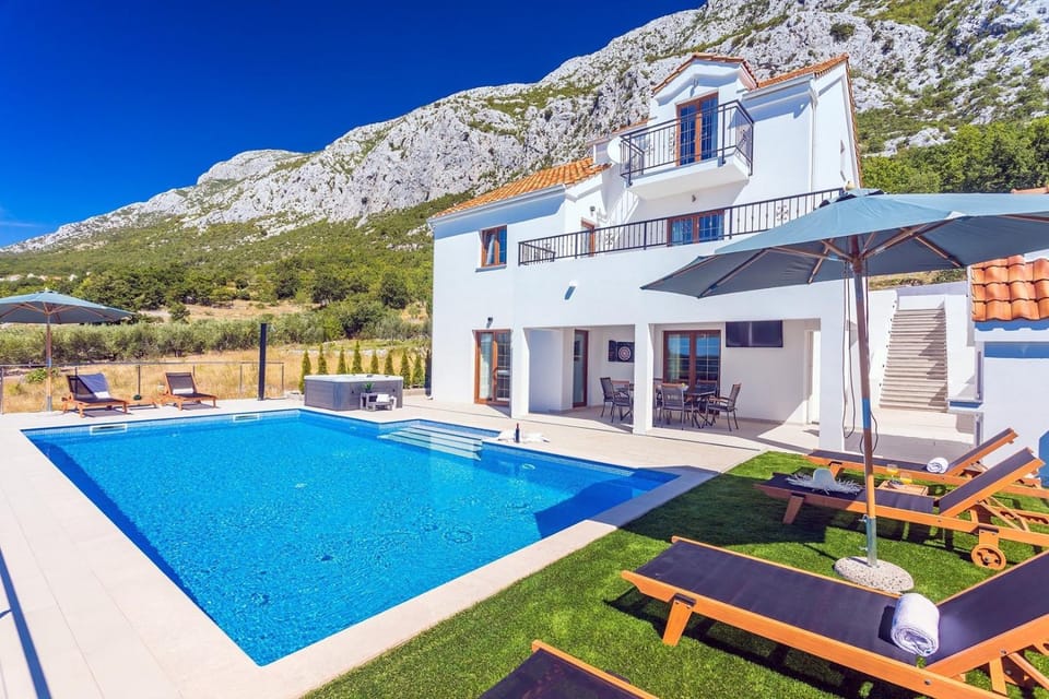 Villa Flora with a 53 sqm private pool with Cinema room with projector and 4 en-suite bedrooms Villa in Split-Dalmatia County