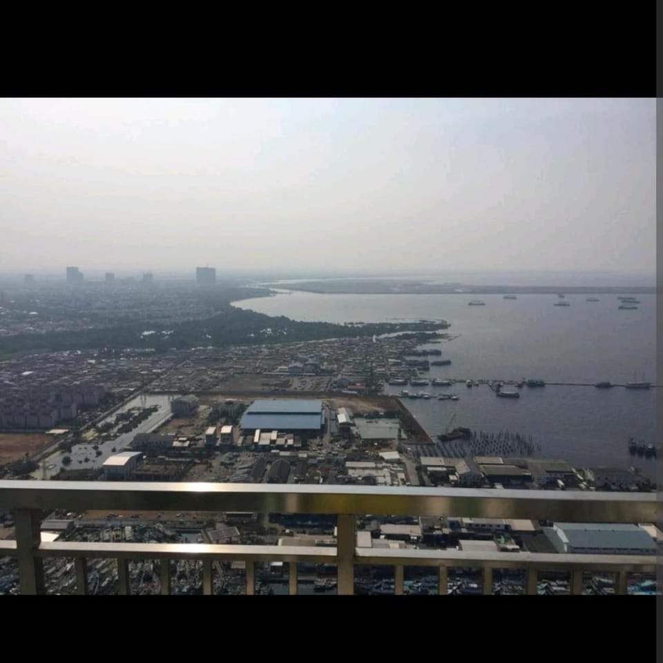 2 BR Jungle Decor Beautiful Sea View Fast Internet Top Of The Mall Apartment in Jakarta