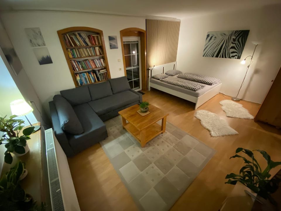 Bed, Library, Living room, Seating area, Bedroom