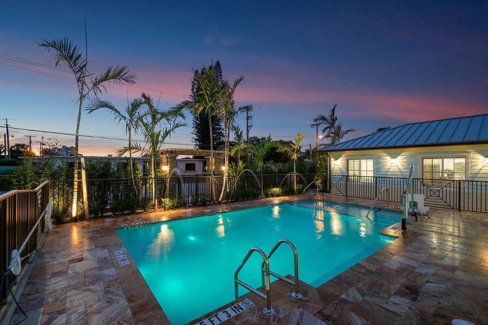 Property building, Patio, Night, Natural landscape, Pool view, Swimming pool, sunbed