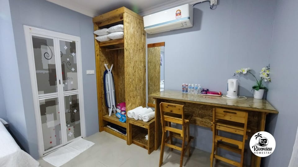 Seating area, towels, wardrobe