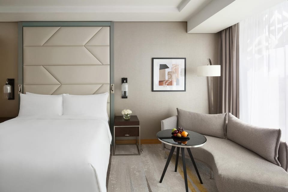 Bed, TV and multimedia, Seating area, Bedroom, City view, City view, Breakfast, room service