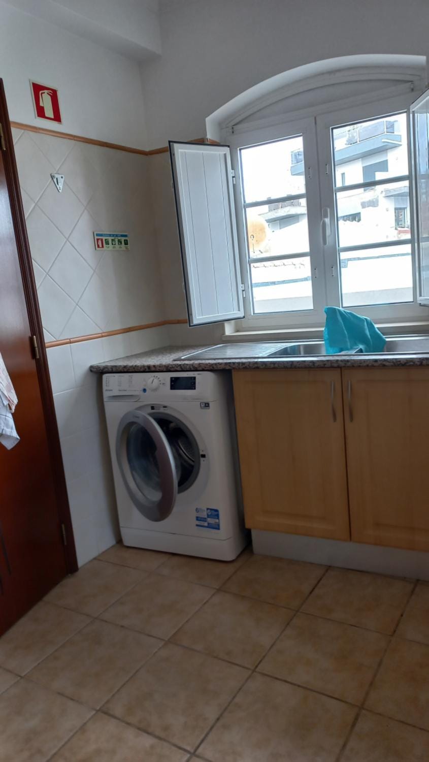 Kitchen or kitchenette, washing machine