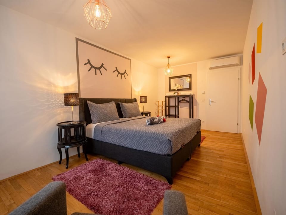 Bed, Decorative detail, Seating area, Bedroom, towels, wardrobe