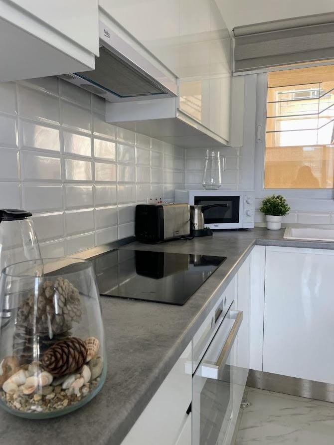 Kitchen or kitchenette, microwave, oven, stove