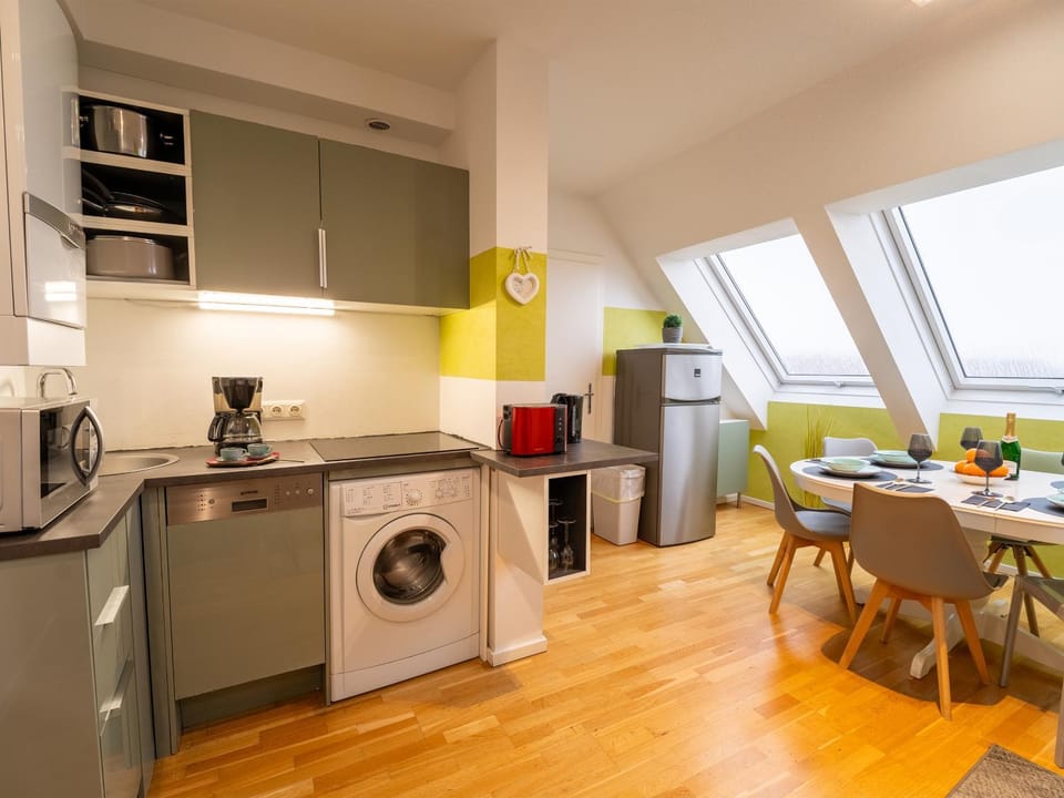 Dining area, dishwasher, microwave, stove, toaster, washing machine, kitchen