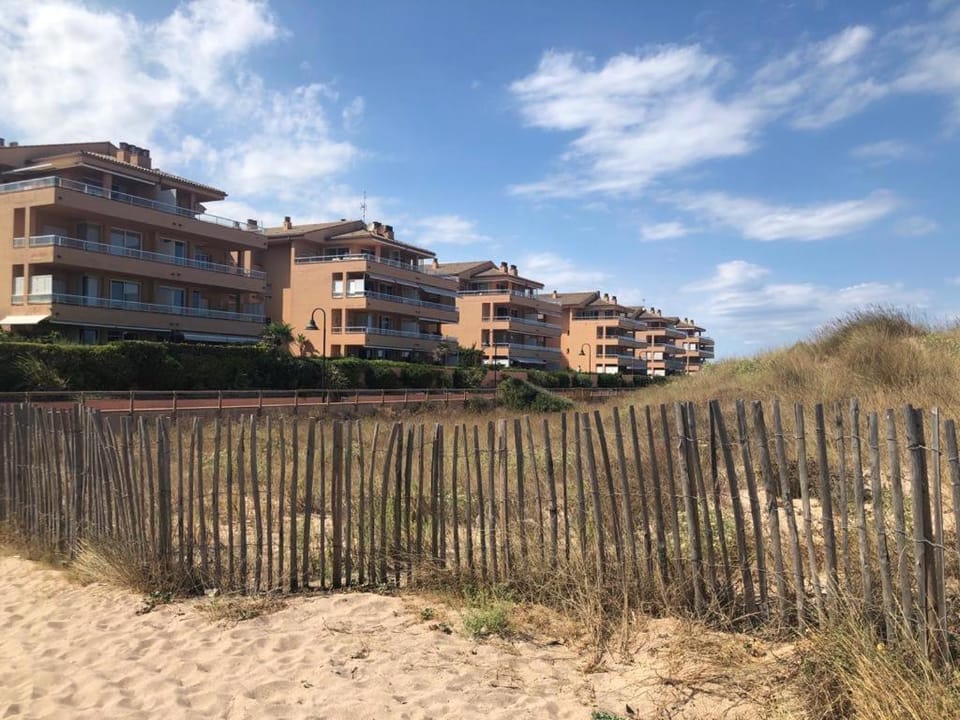 Property building, Nearby landmark, Neighbourhood, Natural landscape, Beach