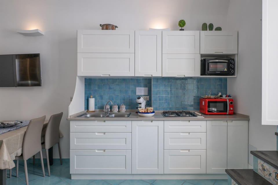 Kitchen or kitchenette, stove, toaster