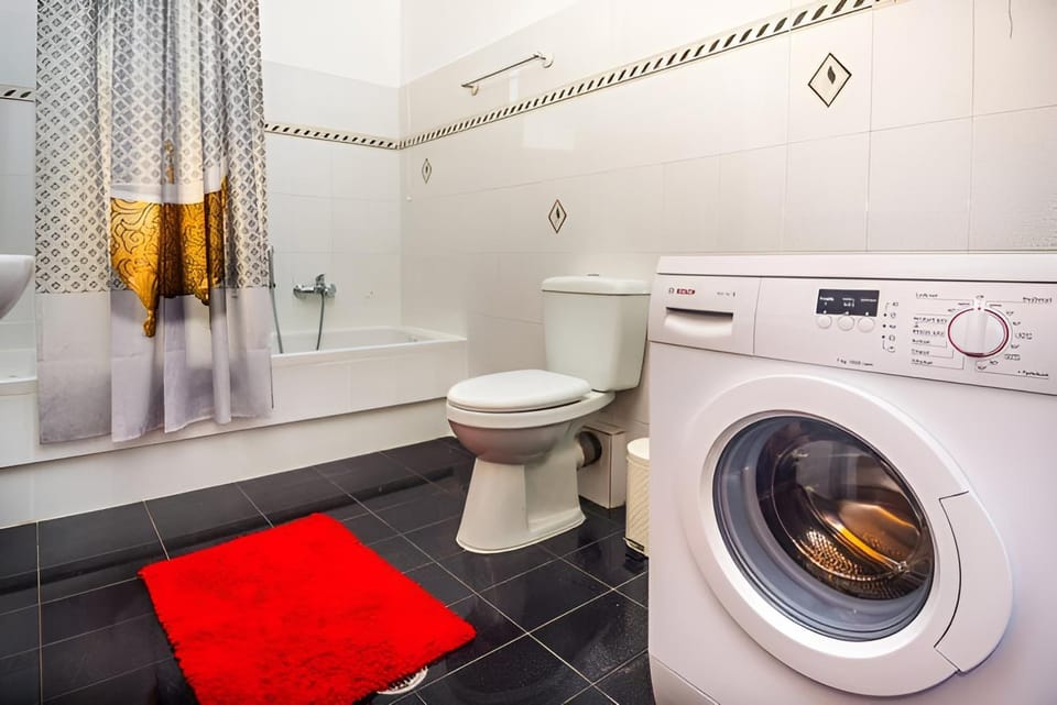Toilet, Bathroom, towels, washing machine