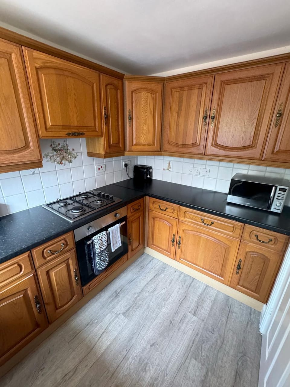 Kitchen or kitchenette, microwave, oven, stove, toaster, kitchen