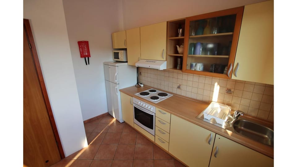 Kitchen or kitchenette, oven, stove