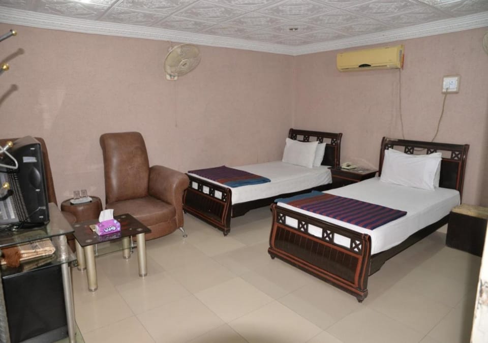 Bed, Seating area, Bedroom, hair dresser, air conditioner