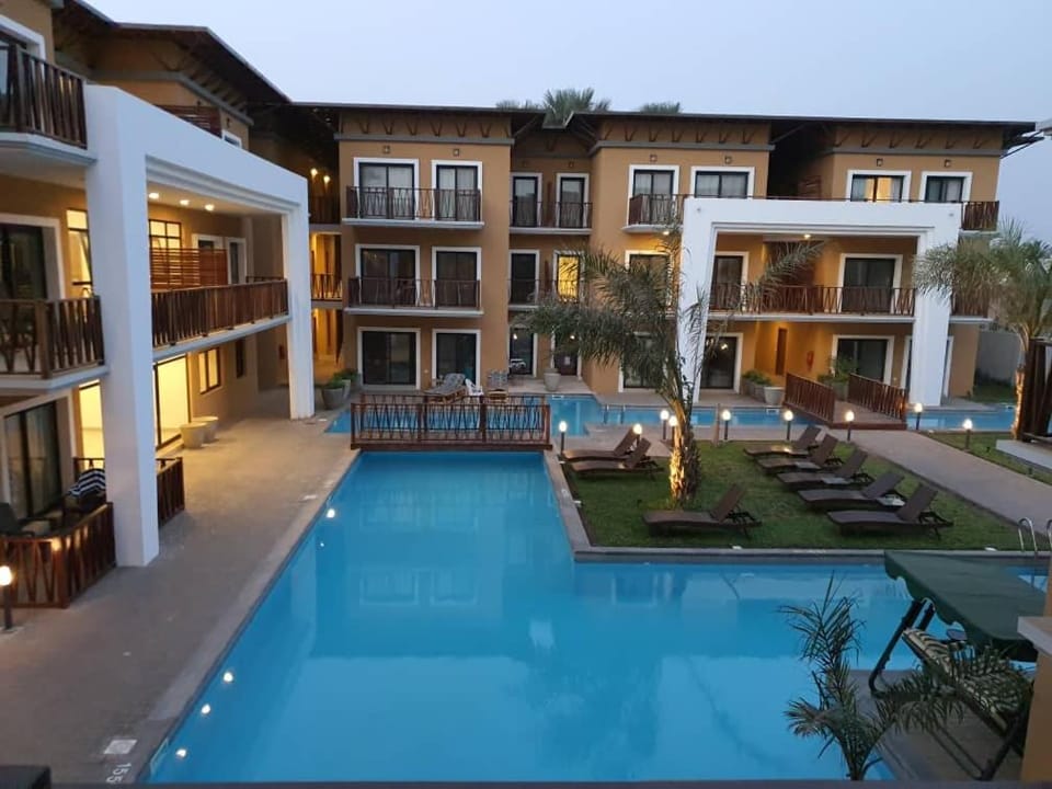 Property building, Patio, Communal lounge/ TV room, Day, Evening entertainment, Pool view, Swimming pool, sunbed