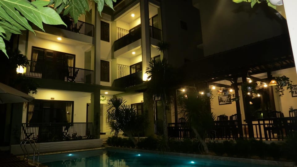 Property building, Patio, Night, Pool view, Swimming pool