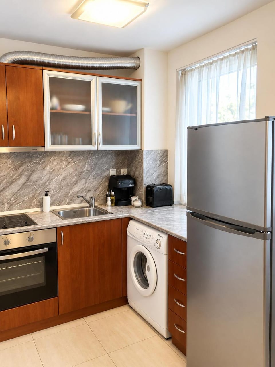 Kitchen or kitchenette, minibar, oven, stove, toaster, dryer