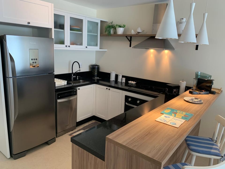 Kitchen or kitchenette, dishwasher, oven, stove, toaster