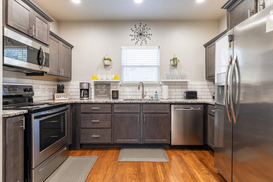 Kitchen or kitchenette, dishwasher, oven, stove, toaster