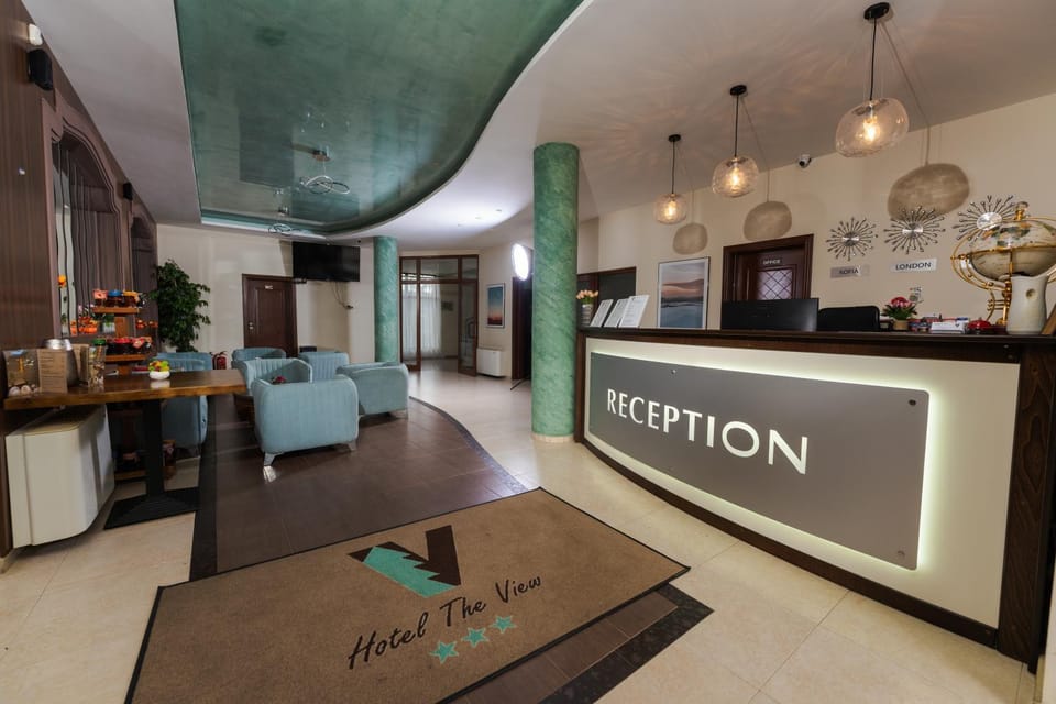 Property logo or sign, Lobby or reception, Seating area, Text overlay