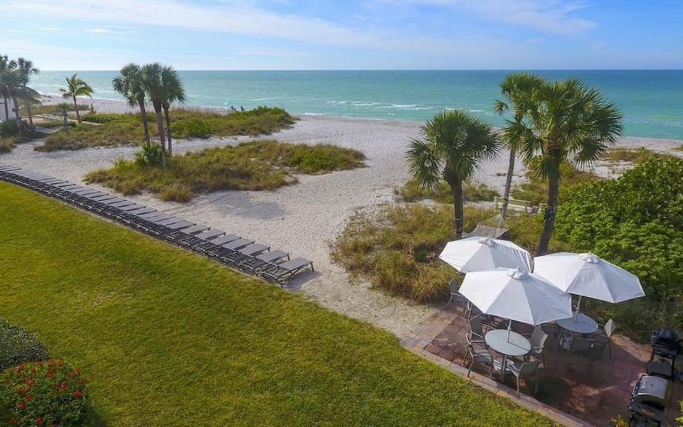LaPlaya 201C Breathtaking Gulf panorama from this corner end unit with a private stairway to the beach Apartment in Longboat Key