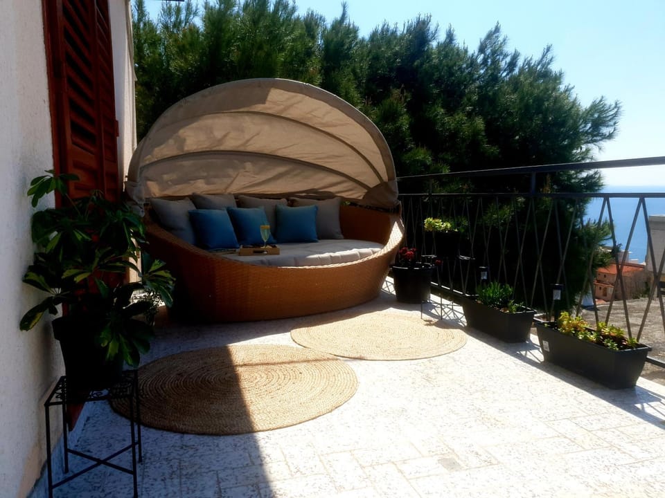 View (from property/room), Balcony/Terrace, Balcony/Terrace, Seating area, Sea view, Sunset