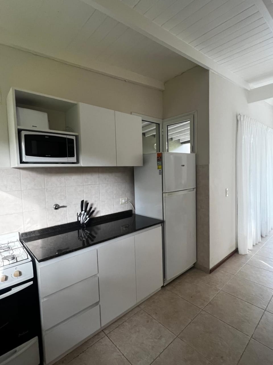 Kitchen or kitchenette, microwave, oven, toaster