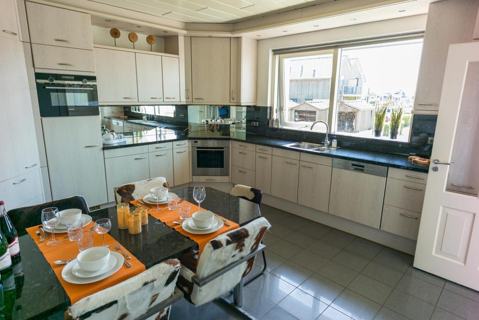 Kitchen or kitchenette, dishwasher, oven, stove
