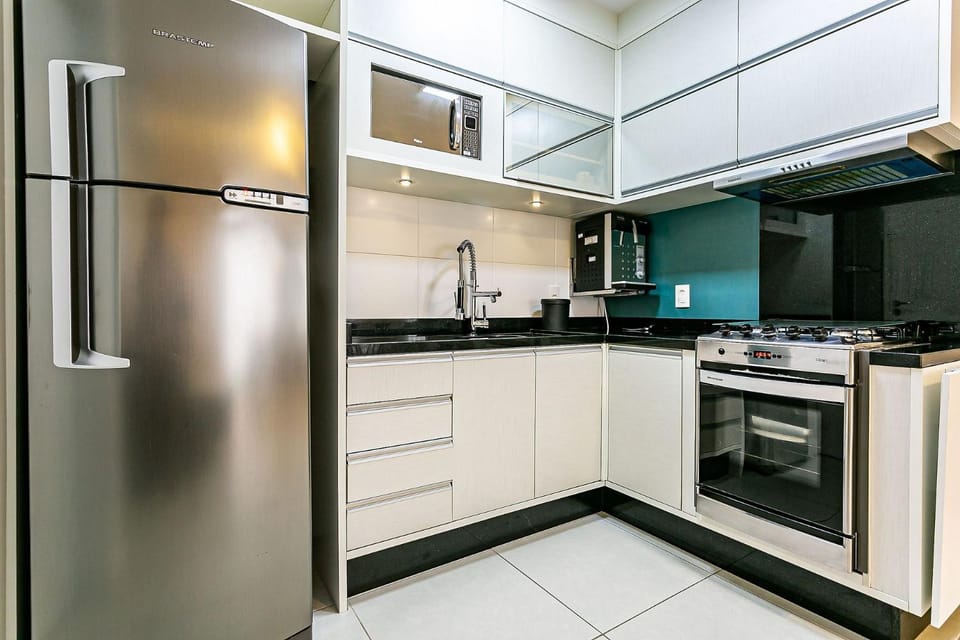 Kitchen or kitchenette, microwave, oven, stove