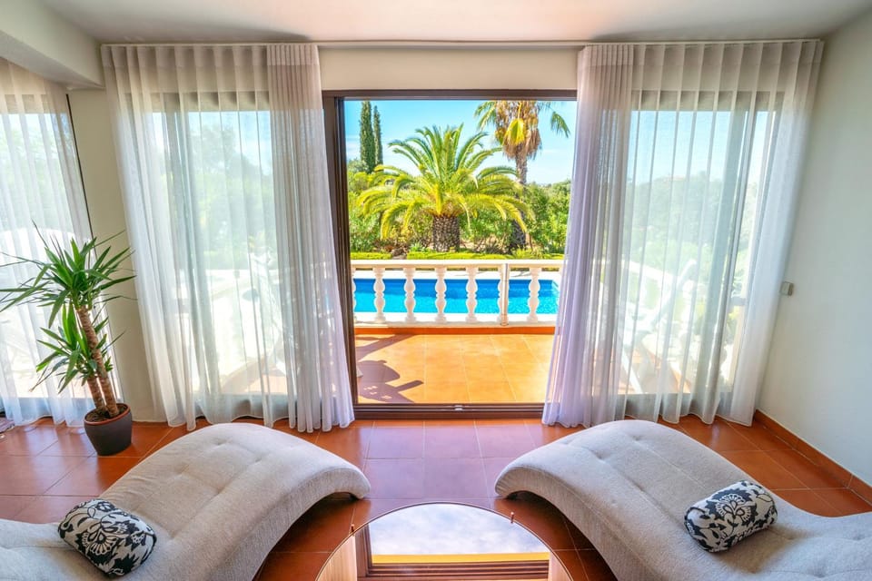 Living room, Seating area, Garden view, Pool view
