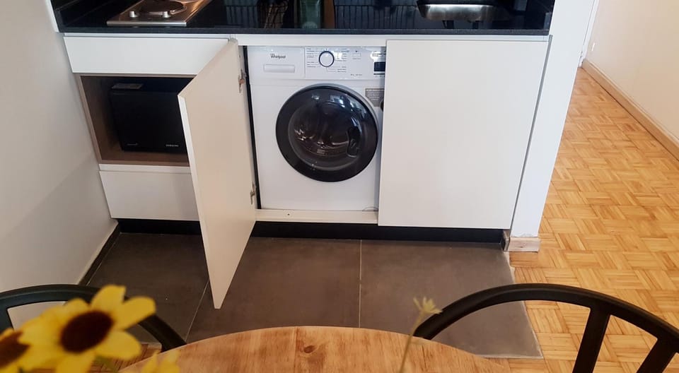 Kitchen or kitchenette, Seating area, Dining area, laundry, laundry, washing machine