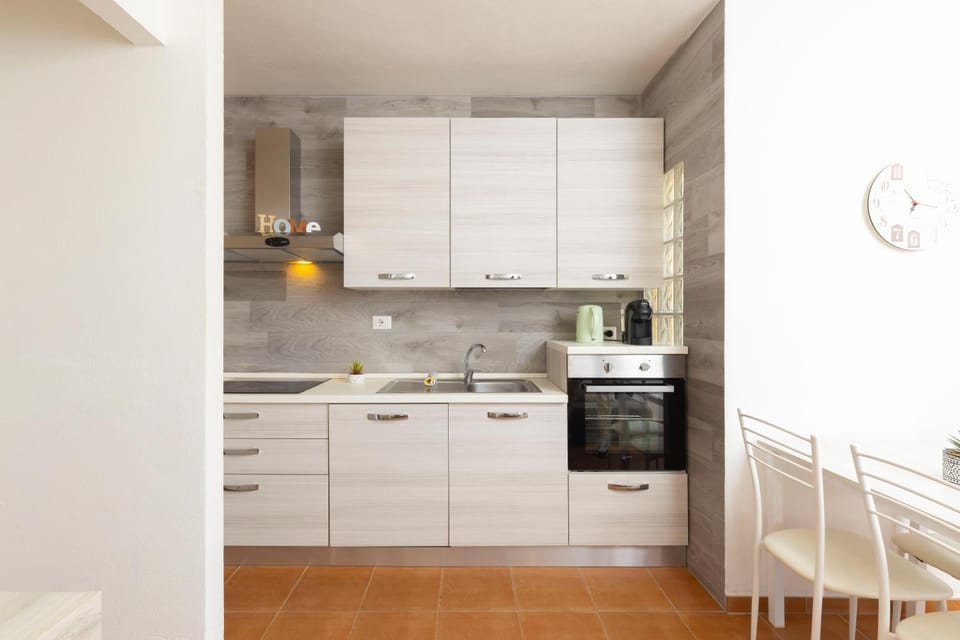Kitchen or kitchenette, dishwasher, oven, stove