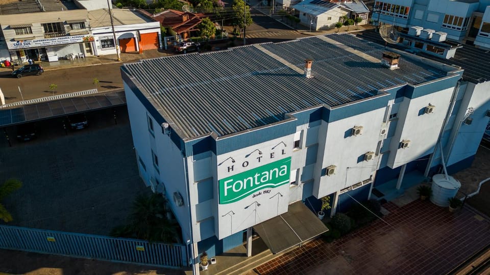 Property building, Facade/entrance, Day, Property logo or sign, Neighbourhood, Bird's eye view, Logo/Certificate/Sign, Street view, Parking