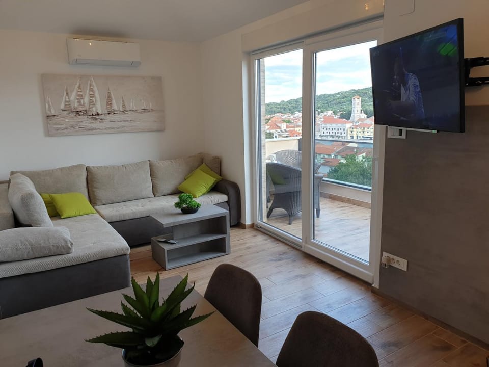 TV and multimedia, Living room, Seating area, City view, Sea view