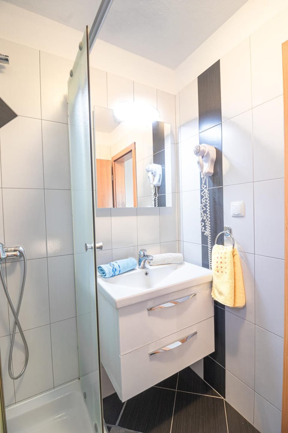 Bathroom, hair dryier, towels