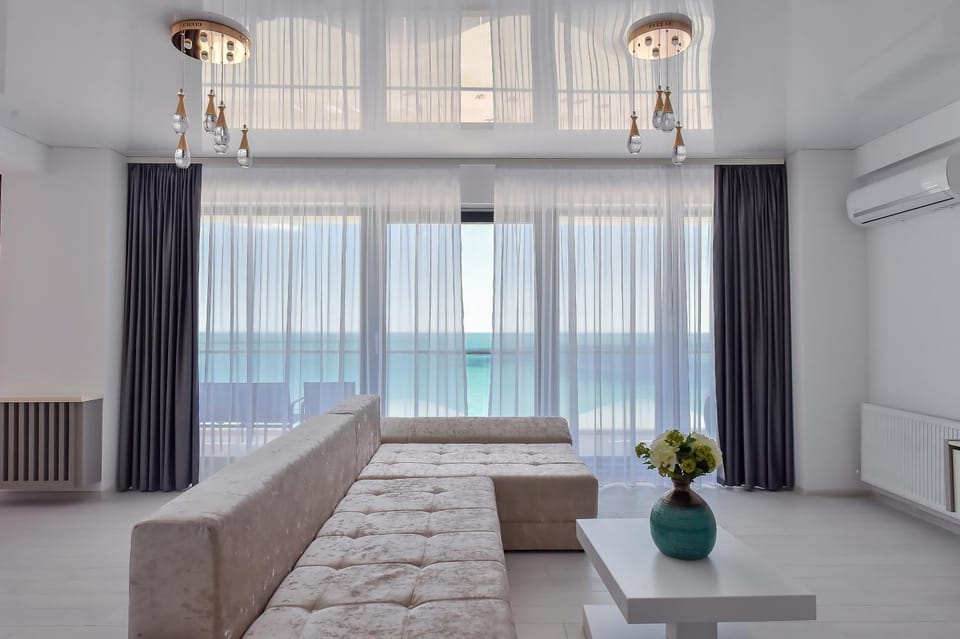 Natural landscape, Living room, Seating area, Sea view, air conditioner