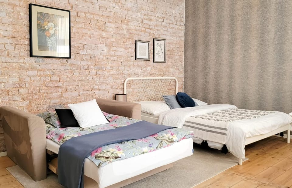 Bed, Living room, Seating area, Bedroom
