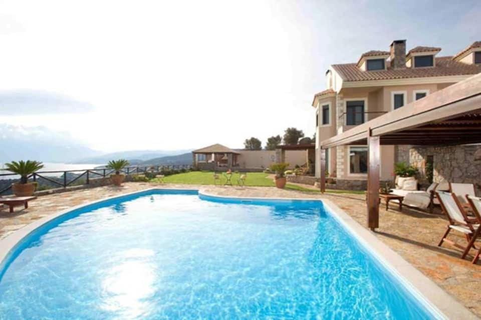 Property building, Patio, Pool view, Swimming pool, sunbed