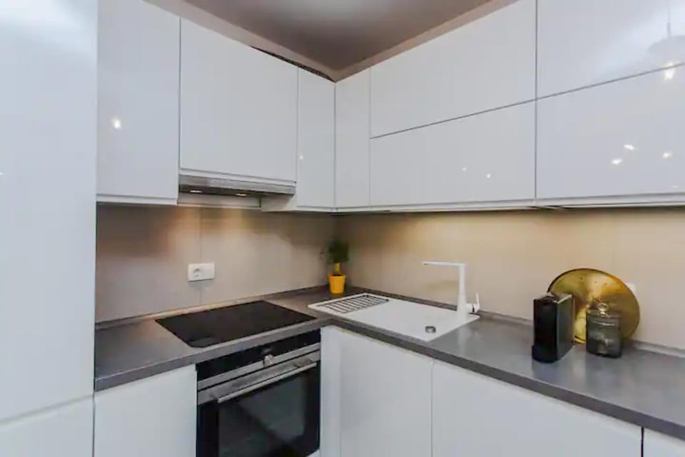 Kitchen or kitchenette, dishwasher, oven, stove, toaster