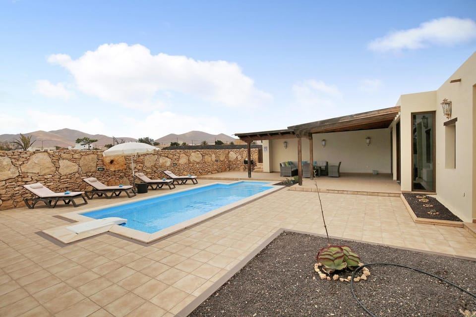 Property building, Living room, Swimming pool