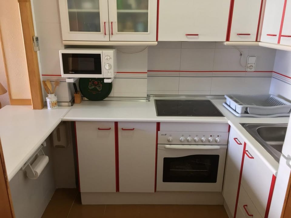 Kitchen or kitchenette, oven, stove