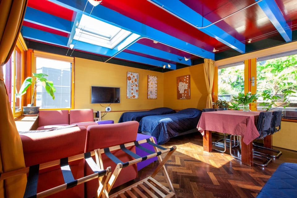 Dreamtime Houseboat Docked boat in Amsterdam