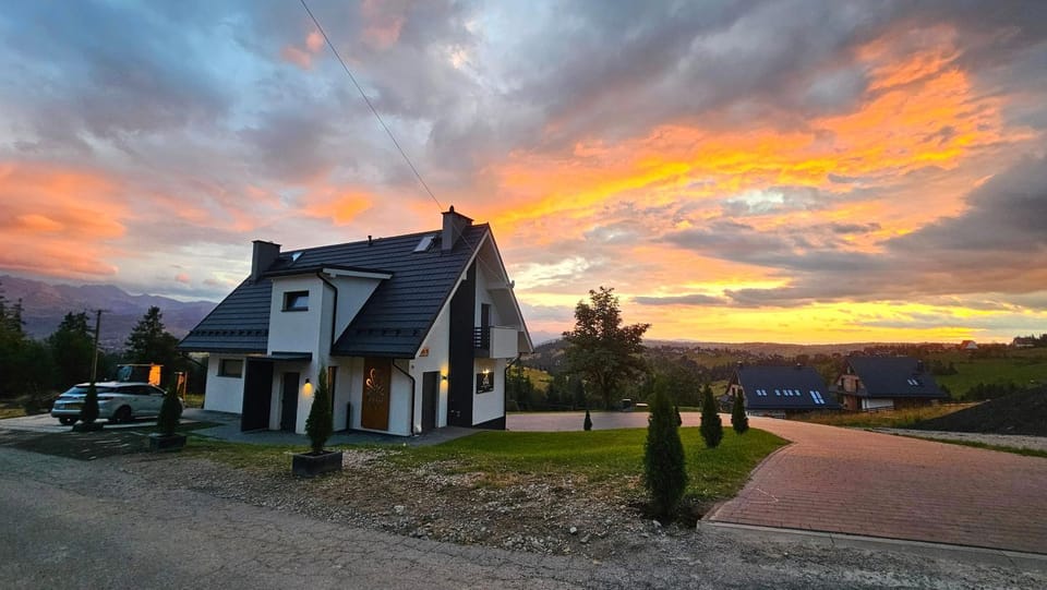 Property building, Neighbourhood, Natural landscape, Sunset, Parking