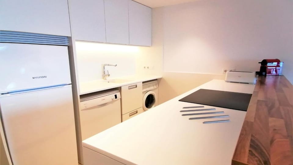 Kitchen or kitchenette, dishwasher, stove, washing machine