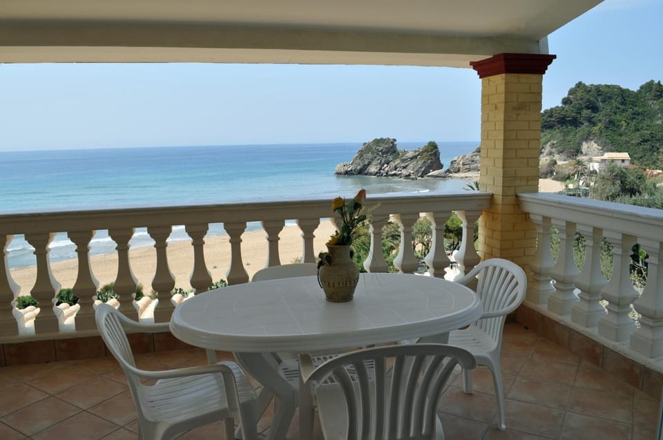 View (from property/room), Balcony/Terrace, Beach, furniture