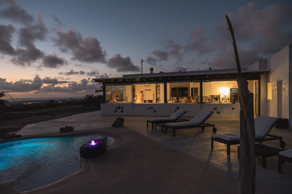 Property building, Restaurant/places to eat, Swimming pool, Entertainment, Sunset