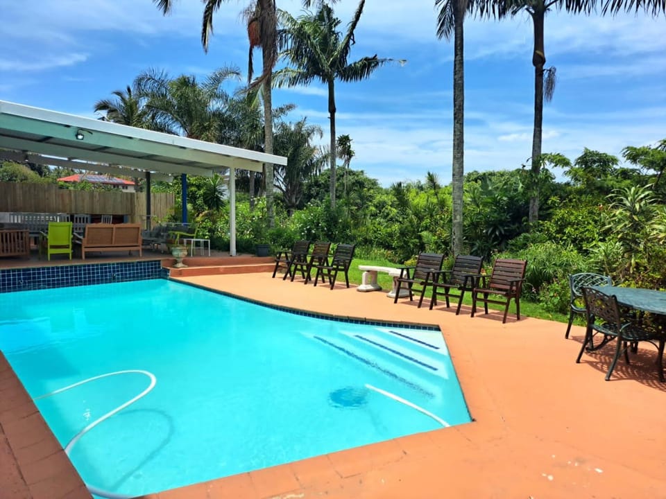 Property building, Patio, Natural landscape, Garden, Pool view, Swimming pool