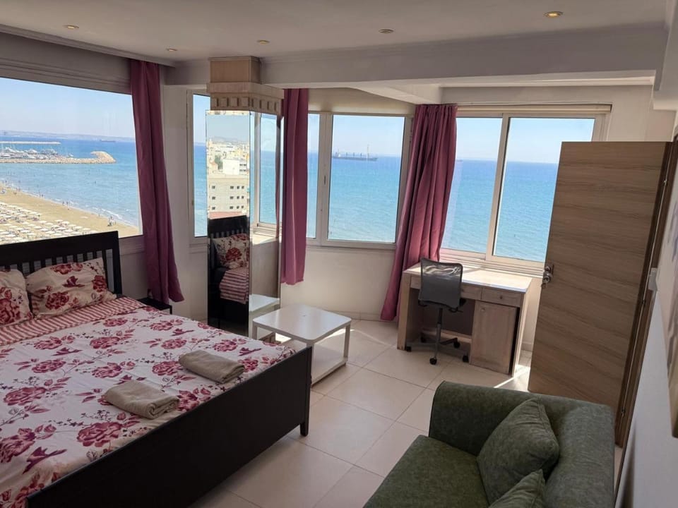 Bed, Natural landscape, Place of worship, Seating area, Bedroom, Sea view