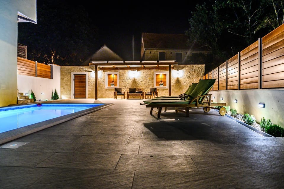 Property building, Patio, Night, Pool view, Swimming pool, sunbed