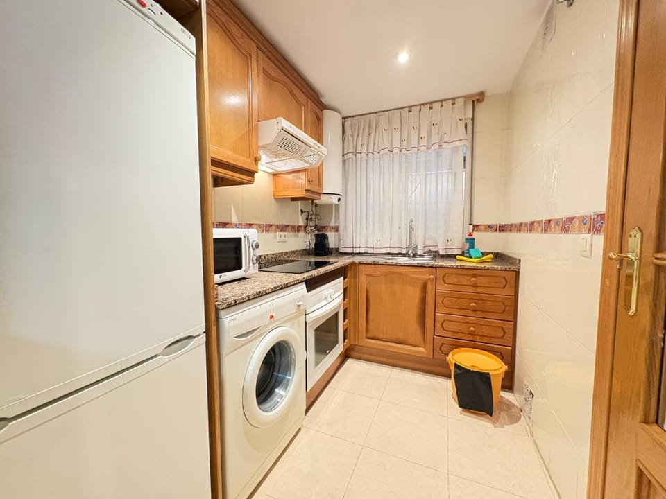 Kitchen or kitchenette, washing machine